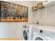 Well-organized laundry room featuring modern appliances, ample shelving, and stylish decor at 6336 Busch Ave, Midland, NC 28107