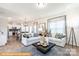 Bright living room showcasing an open layout, stylish furnishings, and a large window at 6336 Busch Ave, Midland, NC 28107