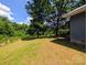 Spacious backyard with mature trees, offering shade and privacy at 647 Mckay Hill Rd, Mount Gilead, NC 27306
