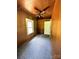 Cozy bedroom with natural light, ceiling fan, and wood paneled walls at 647 Mckay Hill Rd, Mount Gilead, NC 27306
