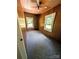 Small bedroom with carpet, a ceiling fan, and two windows with outside views at 647 Mckay Hill Rd, Mount Gilead, NC 27306