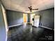 Open kitchen with a white refrigerator, white cabinets, offering room for customization at 647 Mckay Hill Rd, Mount Gilead, NC 27306