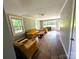 Well-lit living room with hardwood floors, comfortable seating, and a view of the front yard at 647 Mckay Hill Rd, Mount Gilead, NC 27306