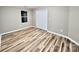 Neutral bedroom with wood-look floors and closet at 6756 Denver Heights Cir, Denver, NC 28037
