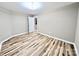 Bedroom boasts hardwood floors, a neutral color scheme, and ample natural light at 6756 Denver Heights Cir, Denver, NC 28037