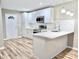 Beautiful kitchen with white cabinetry, marble countertops, stainless appliances and eat-in island at 6756 Denver Heights Cir, Denver, NC 28037