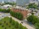 Aerial view featuring the building, tree-lined streets, and proximity to the surrounding neighborhoods, enhancing desirability at 715 N Church St, Charlotte, NC 28202