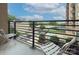 Relaxing balcony space with views of the community pool, mature trees, and neighborhood landscape at 715 N Church St, Charlotte, NC 28202
