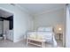 Bright bedroom boasts a neutral color scheme, carpet floors, and an ensuite bath for comfort and convenience at 715 N Church St, Charlotte, NC 28202