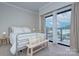 Bright bedroom with large windows offering natural light and an outside view, creating a serene retreat at 715 N Church St, Charlotte, NC 28202