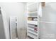 Organized closet with ample shelving and storage solutions, enhancing functionality for your wardrobe needs at 715 N Church St, Charlotte, NC 28202