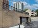 Exterior view of parking garage behind the building with residential buildings in background at 715 N Church St, Charlotte, NC 28202
