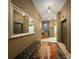 Wide hallway leading to elevators with bench and mirror inside of building at 715 N Church St, Charlotte, NC 28202