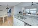 Spacious kitchen featuring a sink with granite countertop and view of dining area at 715 N Church St, Charlotte, NC 28202