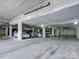 Large garage with indoor parking for residents, marked for low clearance at 715 N Church St, Charlotte, NC 28202