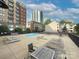 Pool area that has lounge seating available to residents outside on a sunny day at 715 N Church St, Charlotte, NC 28202