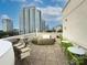 Inviting roof deck with comfortable seating and stunning city views for relaxing and entertaining at 715 N Church St, Charlotte, NC 28202