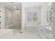 Bright bathroom with a glass shower, soaking tub, and white vanity at 722 Clegg Farm Dr, York, SC 29745
