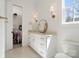 Bright bathroom featuring vanity with drawers, with walk-in closet adjacent to bathroom at 722 Clegg Farm Dr, York, SC 29745