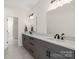 Modern bathroom with double vanity, white marble countertops and black fixtures at 722 Clegg Farm Dr, York, SC 29745