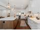 Bright, white kitchen featuring an island, stainless steel appliances, and modern lighting at 722 Clegg Farm Dr, York, SC 29745