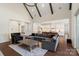 Open-concept living room and kitchen with hardwood floors and exposed beams at 722 Clegg Farm Dr, York, SC 29745