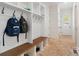 Mudroom with built-in bench, storage lockers, and brick flooring at 722 Clegg Farm Dr, York, SC 29745