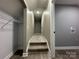 Basement hallway with steps and view of a laundry area at 8701 W Dixie Dr, Charlotte, NC 28278