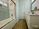 Stylish bathroom featuring tub and shower combination with white subway tile at 8701 W Dixie Dr, Charlotte, NC 28278