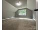 Spacious carpeted bedroom with ample natural light at 8701 W Dixie Dr, Charlotte, NC 28278
