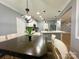 A spacious dining room flows into a kitchen with stainless steel appliances and an island at 8701 W Dixie Dr, Charlotte, NC 28278