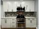 A well-organized kitchen features modern stainless steel appliances and white cabinetry at 8701 W Dixie Dr, Charlotte, NC 28278