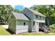 This home offers a spacious backyard with rear entry to the deck and crawl space, with gray vinyl siding at 8701 W Dixie Dr, Charlotte, NC 28278