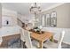 Elegant dining room featuring wainscoting, a stylish chandelier, and a bright, inviting atmosphere for gatherings at Lot 003 Bozeman Ct # 3, Stanley, NC 28164