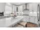 Bright kitchen features white cabinets, stainless steel appliances, and a center island at Lot 003 Bozeman Ct # 3, Stanley, NC 28164