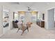 Bright bonus room features neutral walls, two windows, ceiling fan, and comfortable seating area at Lot 003 Bozeman Ct # 3, Stanley, NC 28164