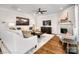 Cozy living room with fireplace, ceiling fan, stylish furnishings, and natural light at Lot 003 Bozeman Ct # 3, Stanley, NC 28164