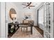 Inviting office with a work desk, large clock, ample storage, and abundant natural light, ideal for focused work at Lot 003 Bozeman Ct # 3, Stanley, NC 28164