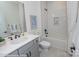 Bright bathroom featuring a tiled shower, tub, modern fixtures, and a stylish vanity at Lot 29 Bozeman Ct # 29, Stanley, NC 28164