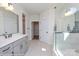 Bright bathroom with a double vanity, tile flooring, and a glass-enclosed shower at Lot 29 Bozeman Ct # 29, Stanley, NC 28164