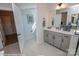 Bright bathroom with a single vanity, tile flooring, and a connecting door to an adjacent room at Lot 29 Bozeman Ct # 29, Stanley, NC 28164
