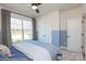 Comfortable bedroom with a queen bed, closet, large window with curtains, and soft carpeting at Lot 29 Bozeman Ct # 29, Stanley, NC 28164