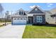 Beautiful single-Gathering home with a two-car garage and lush front lawn at Lot 29 Bozeman Ct # 29, Stanley, NC 28164