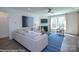 Cozy living room showcasing a fireplace, neutral-toned furniture, large window with light-filtering curtains and a blue rug at Lot 29 Bozeman Ct # 29, Stanley, NC 28164