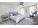 Bright bedroom with large bed, side tables, lamps, decor, ceiling fan, and natural light from windows at Lot 29 Bozeman Ct # 29, Stanley, NC 28164