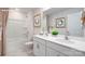 Bright bathroom featuring dual sinks, white cabinetry, and a shower-tub combination at 1044 Horizon Ln, Chester, SC 29706