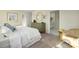 Bright bedroom features plush carpeting, accent chair, and ensuite bathroom access for added convenience at 1044 Horizon Ln, Chester, SC 29706