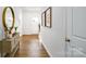 Inviting foyer featuring hardwood flooring, stylish console table, and decor leading to the main living spaces at 1044 Horizon Ln, Chester, SC 29706