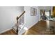 Elegant entryway with wood floors, a staircase, and tasteful decor sets a welcoming tone at 1044 Horizon Ln, Chester, SC 29706