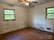 Bedroom featuring hardwood floors, natural light, and neutral walls at 112 Greenwood Ave, Belmont, NC 28012